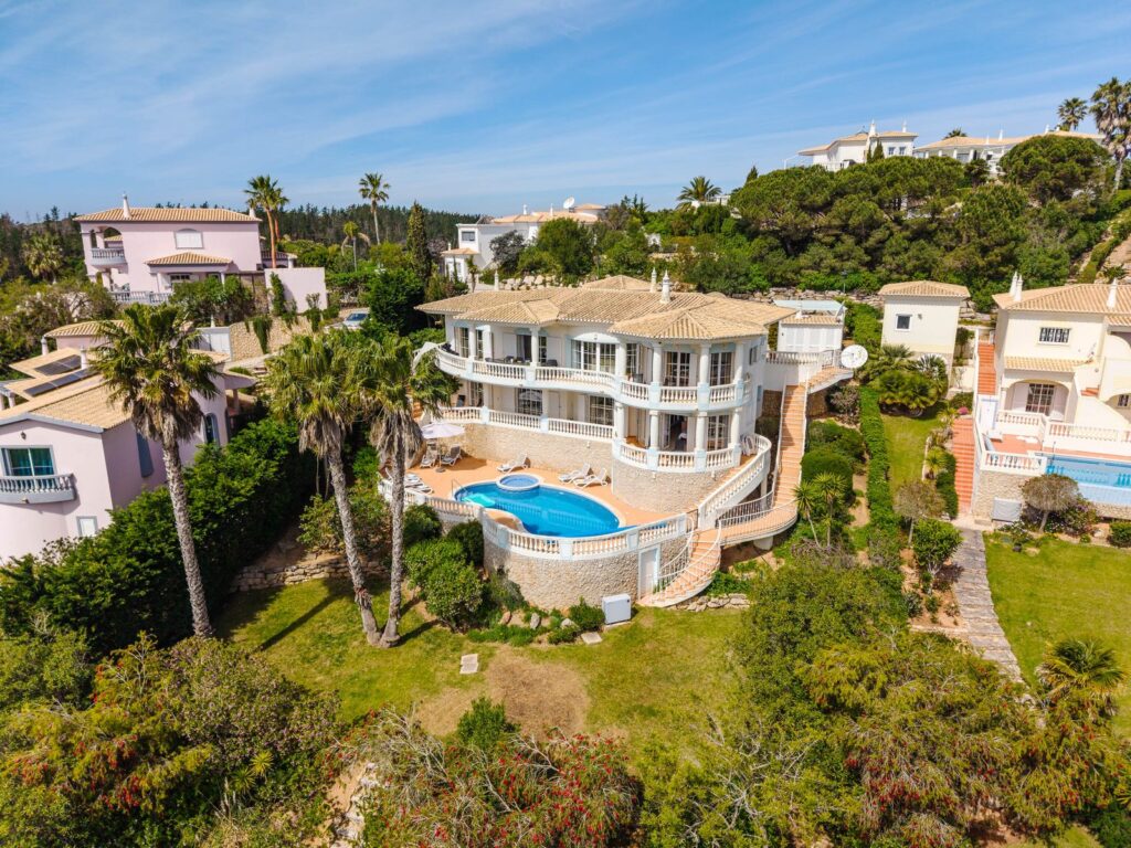 Aerial view of a villa with pool and gardens in the Algarve