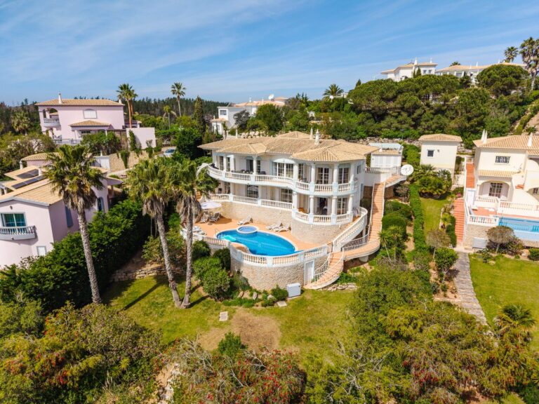 Aerial view of a villa with pool and gardens in the Algarve